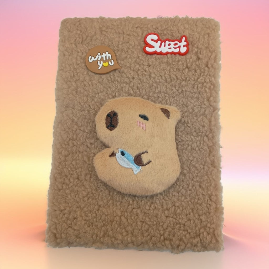 Cuaderno con personajes y peluche