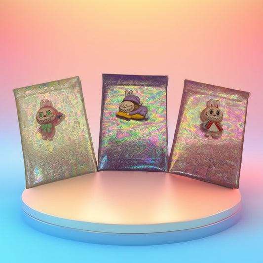 Cadernito con personajes labubu arcoiris capibara peluche
